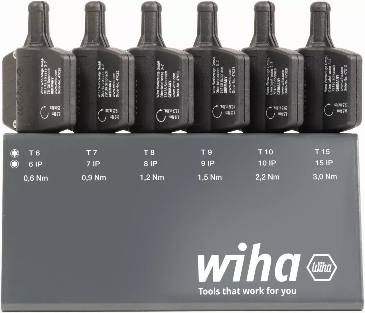 Ensemble de six outils de couple noirs avec différentes valeurs de couple dans un support, étiqueté "wiha"