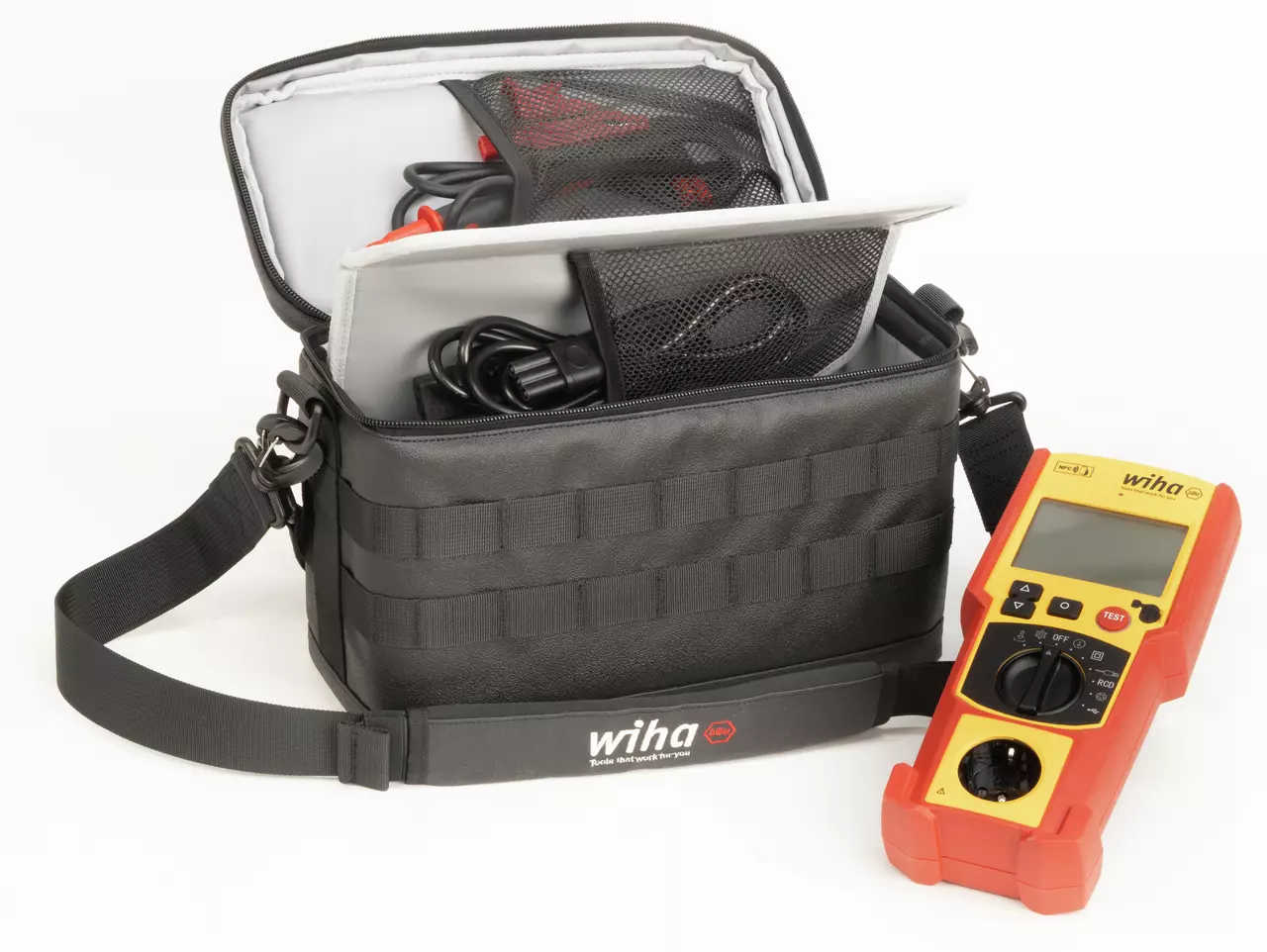 Black tool bag with cables and a yellow-red digital multimeter beside it.