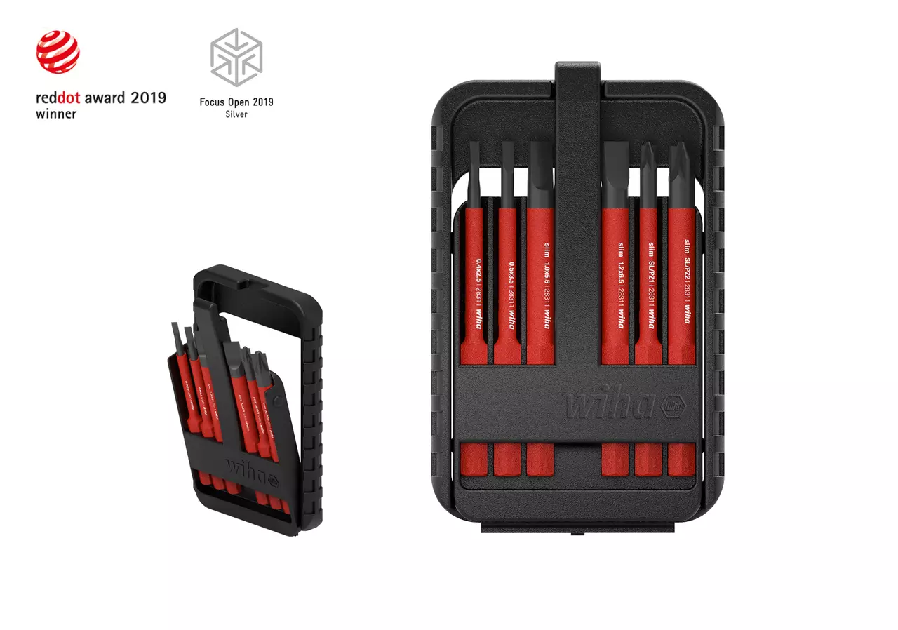 Black case with six red screwdriver bits, awards displayed