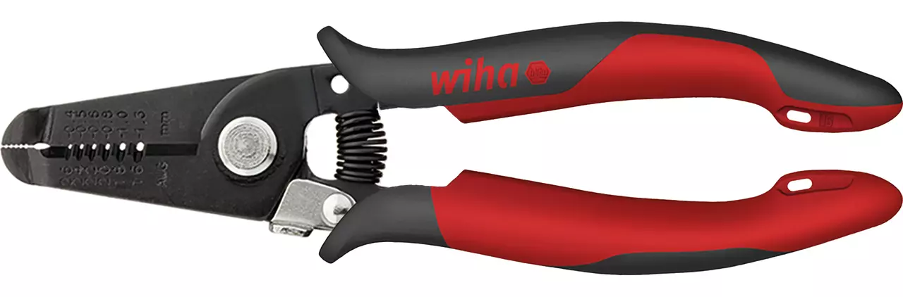 Red and black wire stripper with ergonomic handles and measurement markings.
