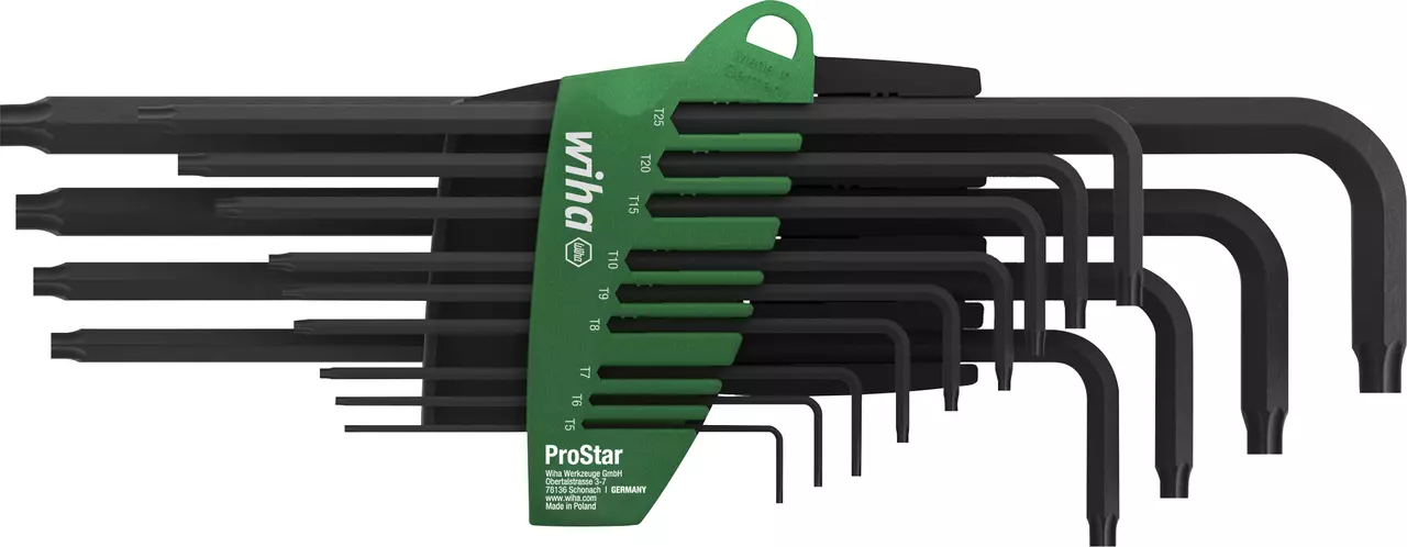 Set of black L-shaped key wrenches in a green holder