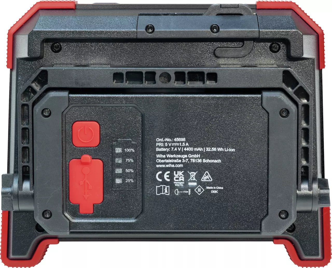 Back of a black device with red power button and USB symbol, battery indicator, and technical details.