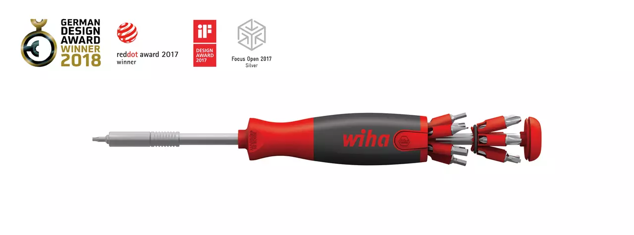 Red and black screwdriver with retractable bits and award logos