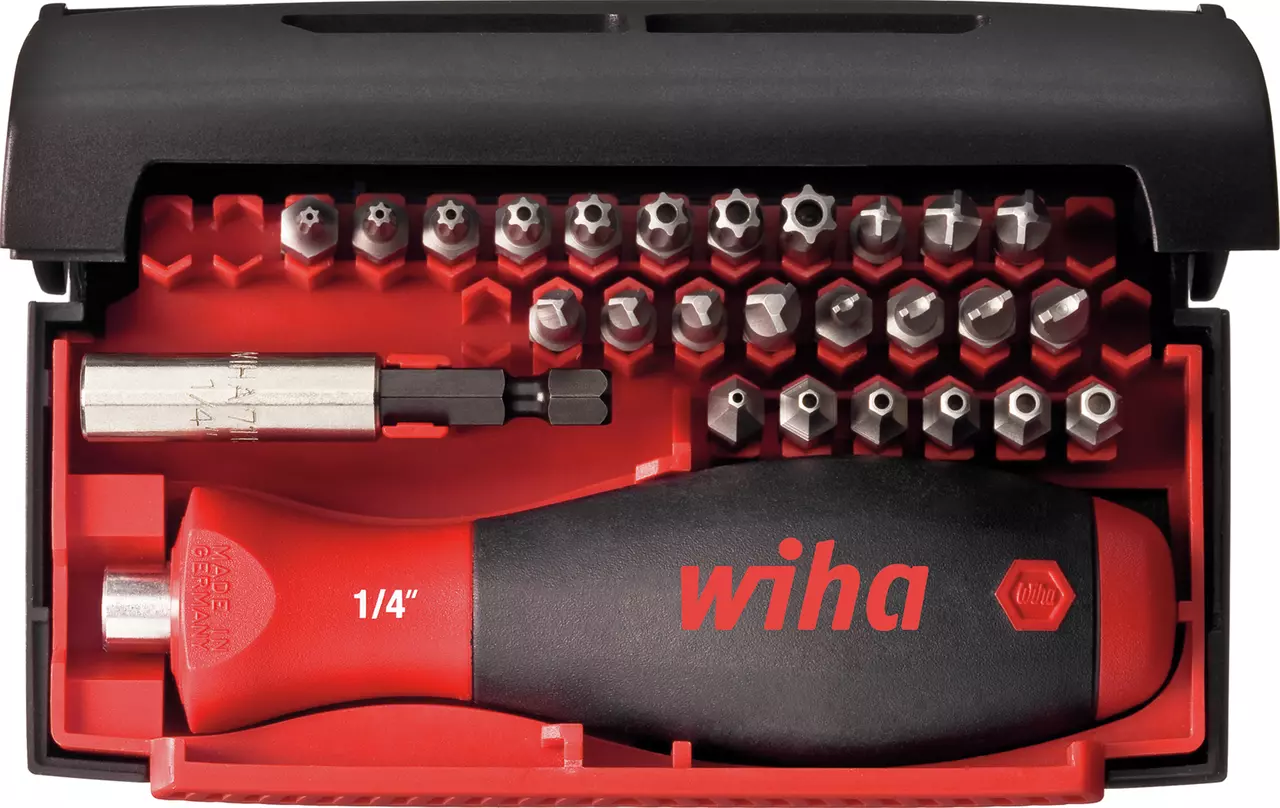 Tool set with screwdriver handle and various bits in a red and black case.