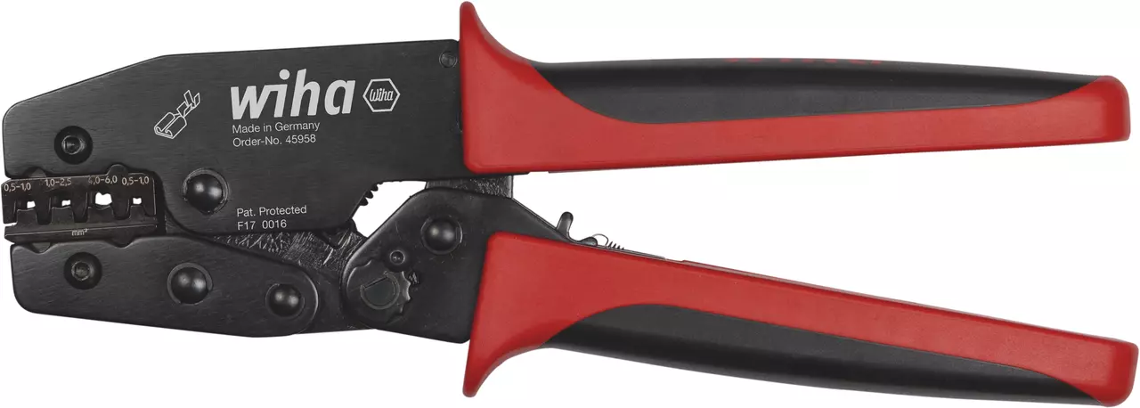 Red and black crimping tool with measurement markings on the jaw.