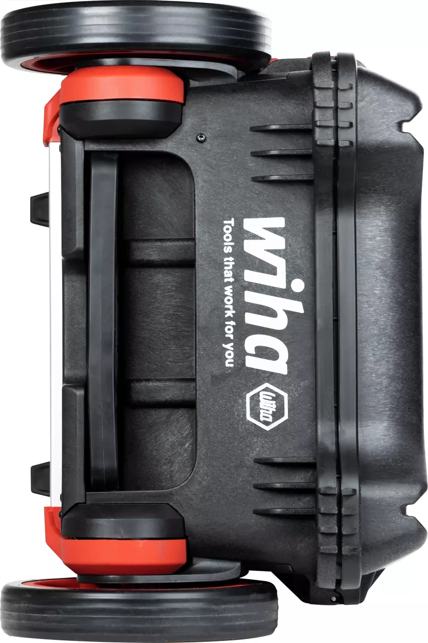 Black tool case with red accents and wheels, side view.