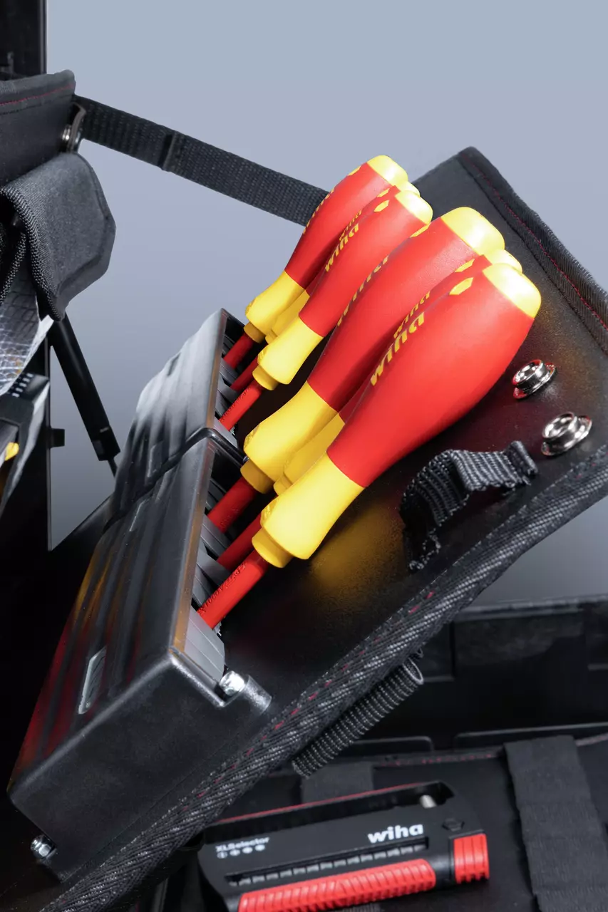 Set of insulated screwdrivers with red and yellow handles in a black case.