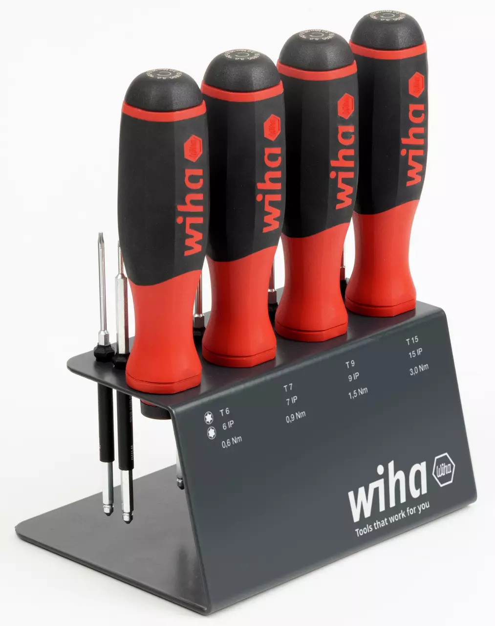 Set of red and black screwdrivers in a stand with torque settings
