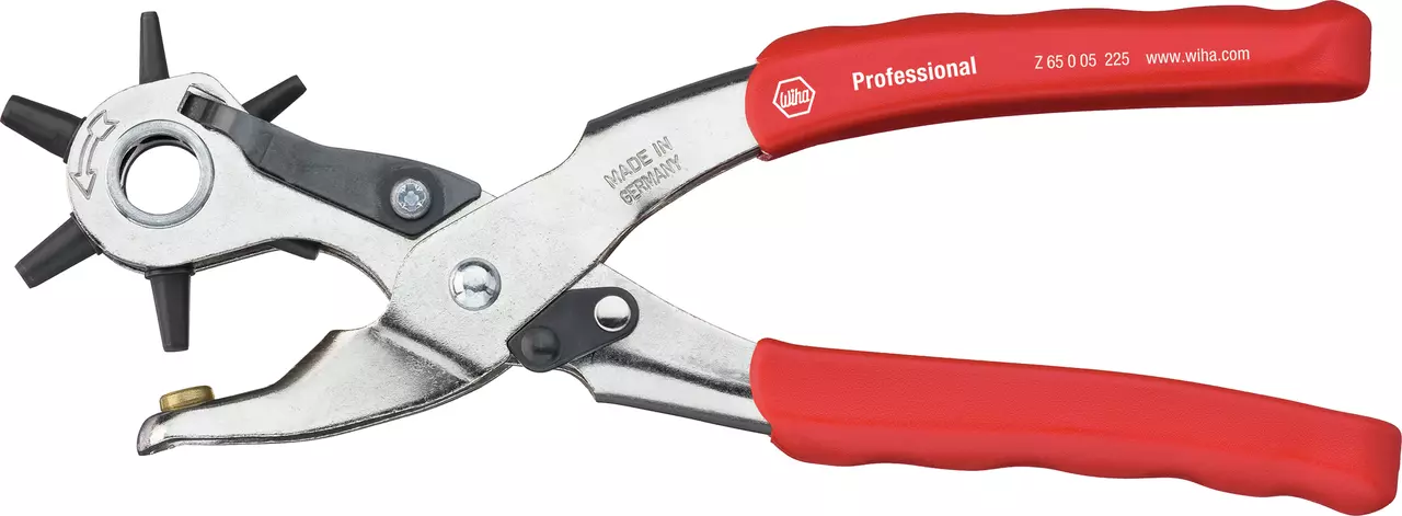 Red-handled revolver hole punch with metal head and rotating wheel for hole sizes.
