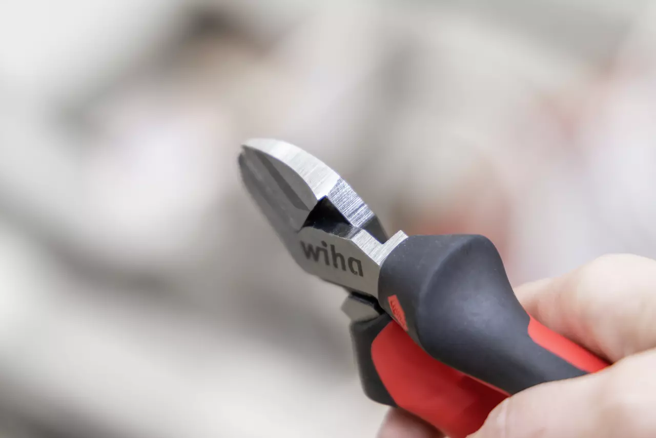 Industrial side cutter with red and black handles